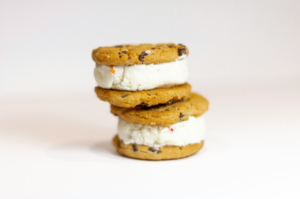 Two chocolate chip cookies filled with cream to demonstrate how content marketing and copywriting work together.
