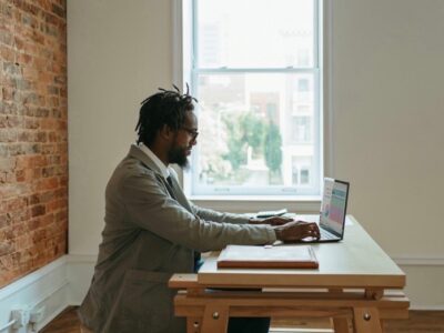 A writer sits at his laptop to get some work done