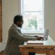 A writer sits at his laptop to get some work done